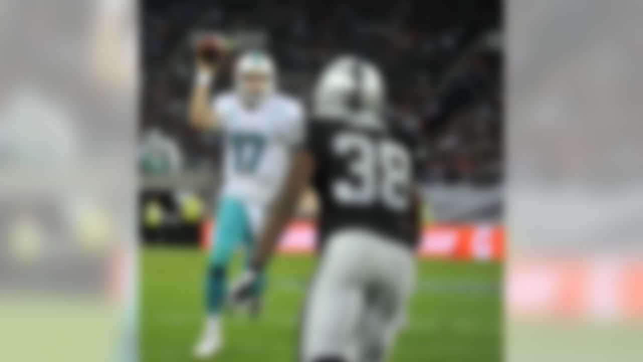 Miami Dolphins quarterback Ryan Tannehill (17) runs with the ball against the Oakland Raiders at Wembley Stadium in London. (Sean Ryan/NFL)