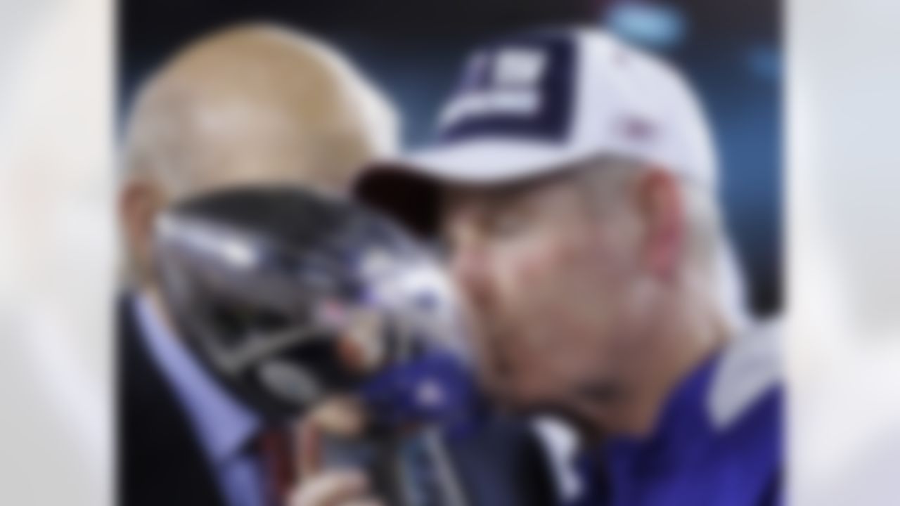 New York Giants head coach Tom Coughlin kisses the Vince Lombardi Trophy after the Giants beat the New England Patriots 17-14 in the Super Bowl XLII football game on Sunday, Feb. 3, 2008, in Glendale, Ariz. (AP Photo/David Duprey)