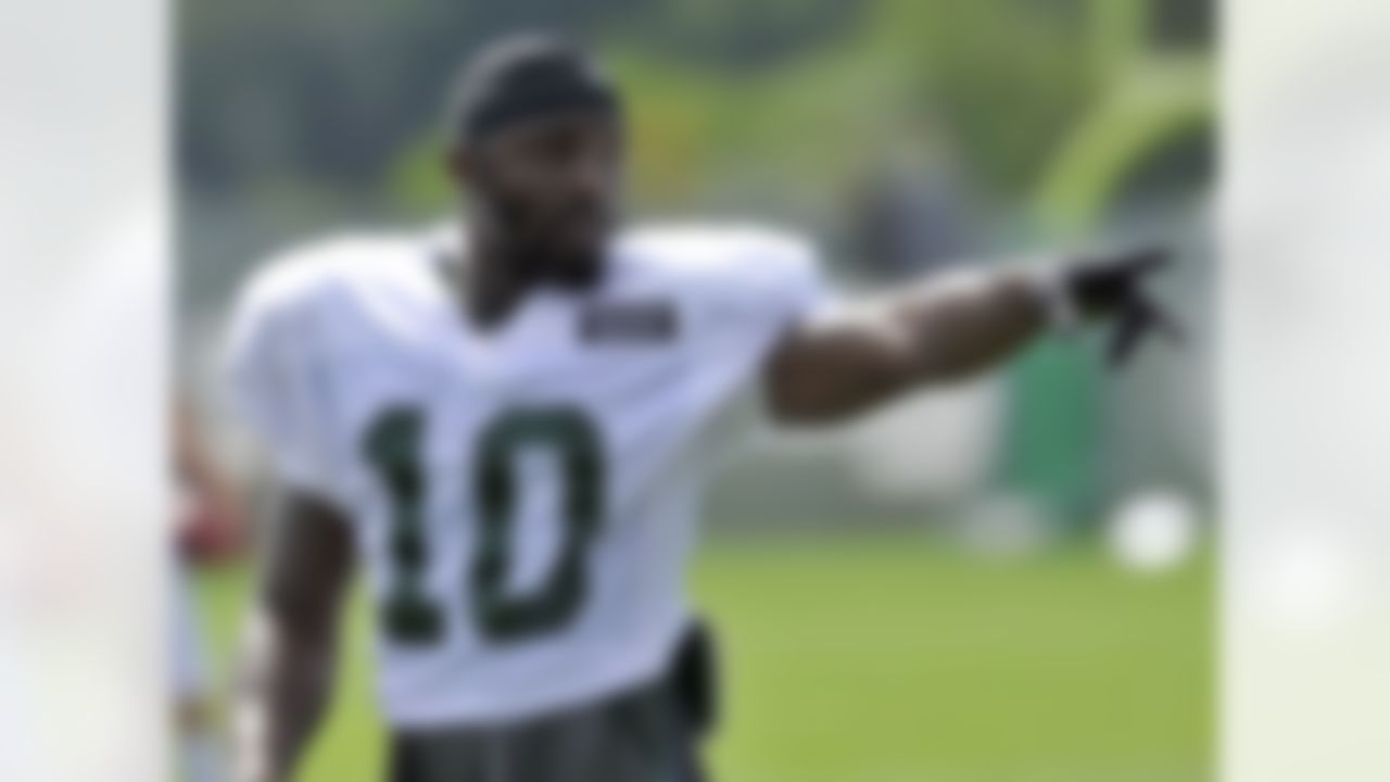 New York Jets wide receiver Santonio Holmes gestures at NFL football training camp on Sunday, July 29, 2012, in Cortland, N.Y. (AP Photo/Bill Kostroun)