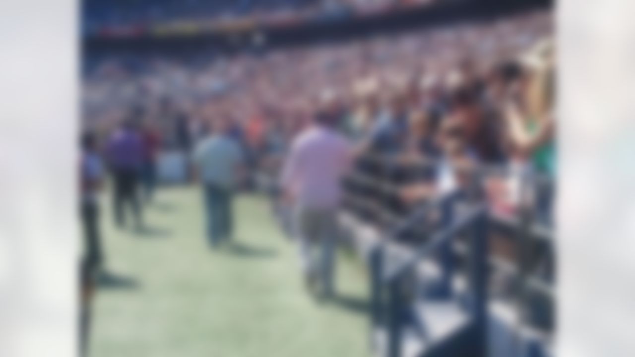 New York Jets quarterback Tim Tebow greets fans as he makes his way to the stage before delivering a sermon at Qualcomm Stadium in San Diego, California on June 17, 2012. (Kenny Legan/NFL)