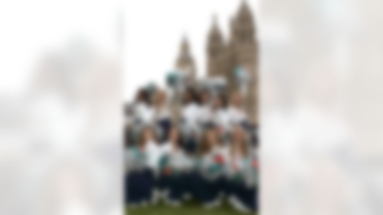Miami Dolphins cheerleaders pose for the media outside the Houses of Parliament in London, Wednesday, Oct. 24, 2007. Miami Dolphins is to play against New York Giants in a NFL match at Wembley Stadium on Sunday Oct. 28. (AP Photo/Sang Tan)