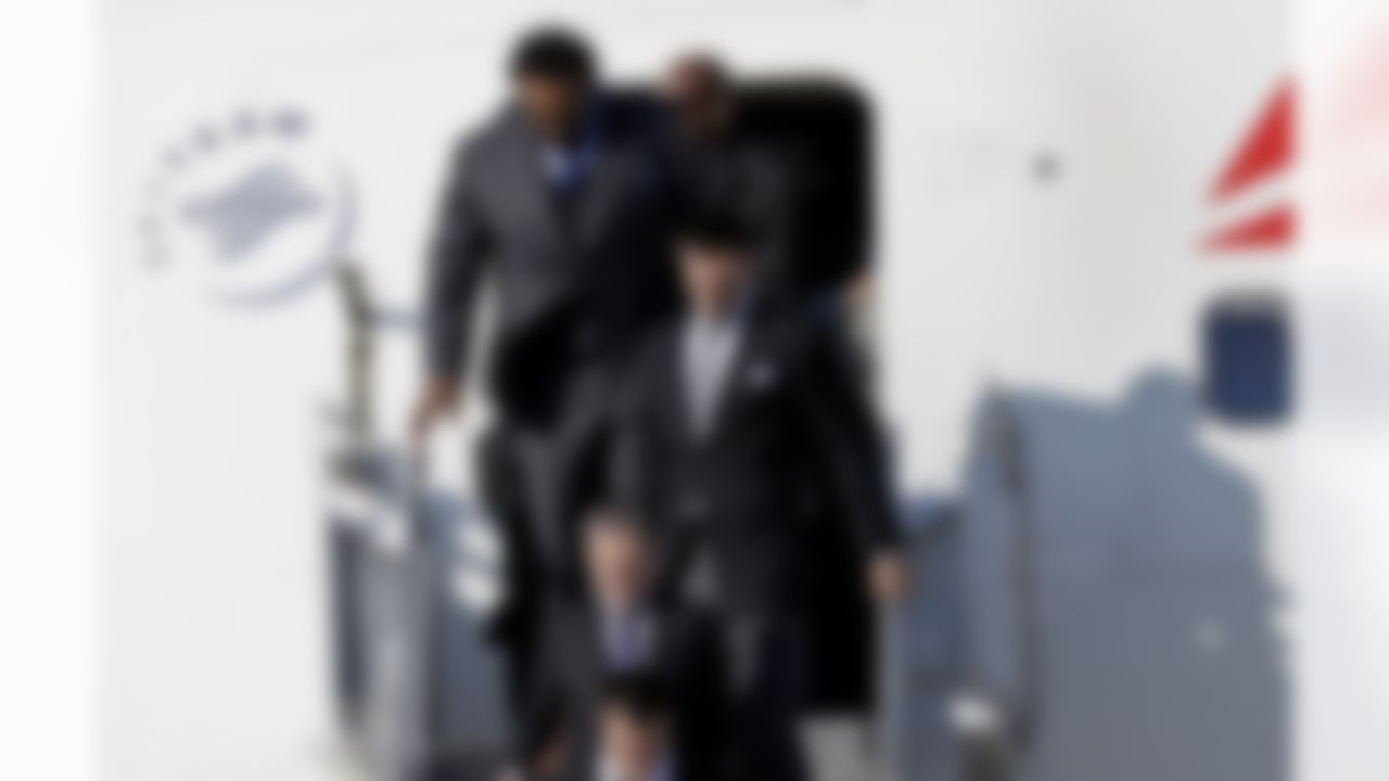 Baltimore Ravens quarterback Joe Flacco (5) walks off the plane with teammates arrive at the Louis Armstrong International Airport for the NFL Super Bowl XLVII football game Monday, Jan. 28, 2013, in New Orleans. (AP Photo/David J. Phillip)