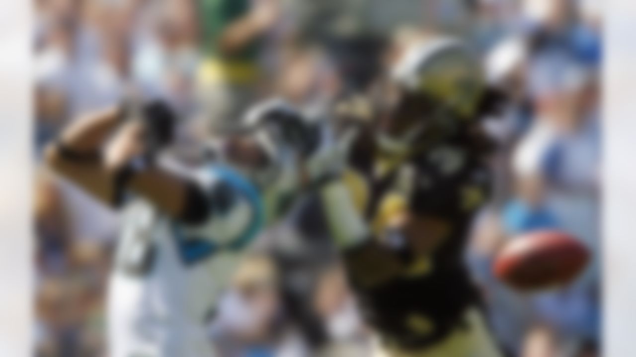 New Orleans' Mike McKenzie (34) breaks up a pass intended for Carolina receiver Drew Carter (left) during the second half of the Panthers 21-18 win Sunday, October 1, 2006, at Bank of America Stadium in Charlotte, North Carolina. Photo by Getty Images.