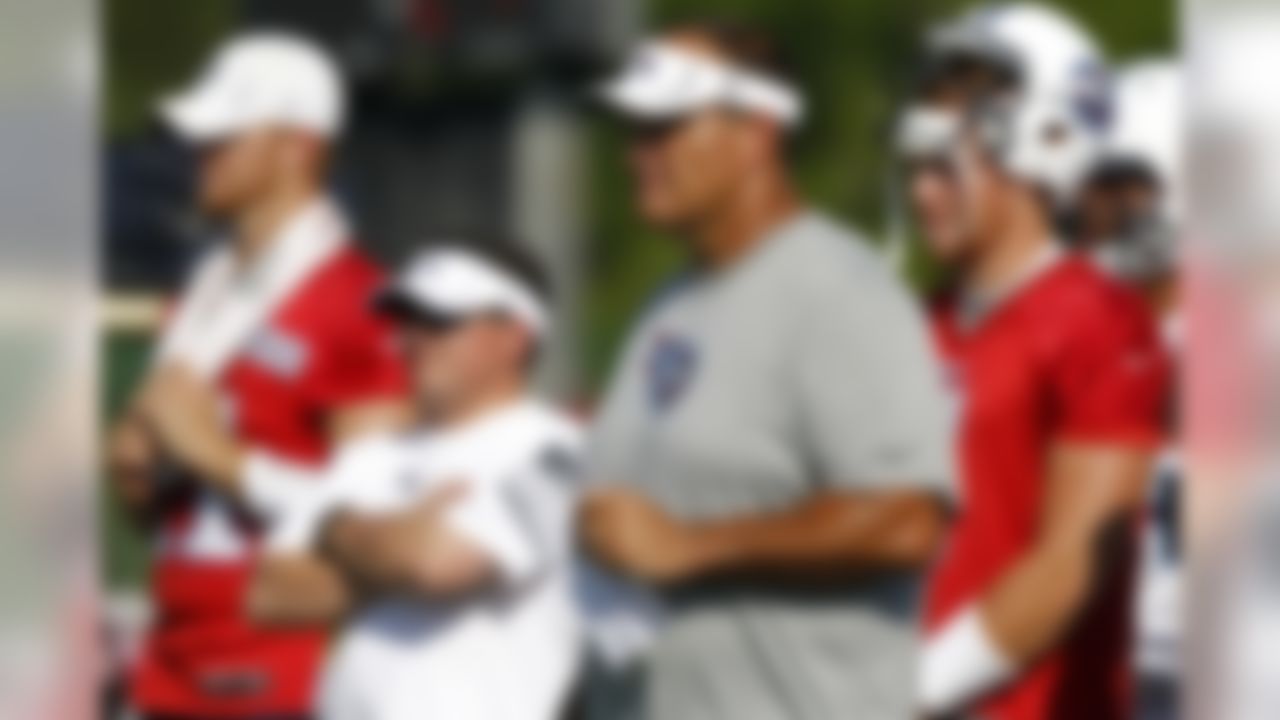 Tennessee Titans offensive line coach Bruce Matthews, in visor, looks on during NFL football camp at Titans' headquarters Saturday, July 28, 2012 Nashville, Tenn. (AP Photo/Wade Payne)