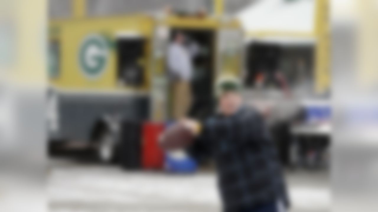 Fans tailgate before an NFL football game between the Green Bay Packers and the Atlanta Falcons Sunday, Dec. 8, 2013, in Green Bay, Wis. (AP Photo/Mike Roemer)