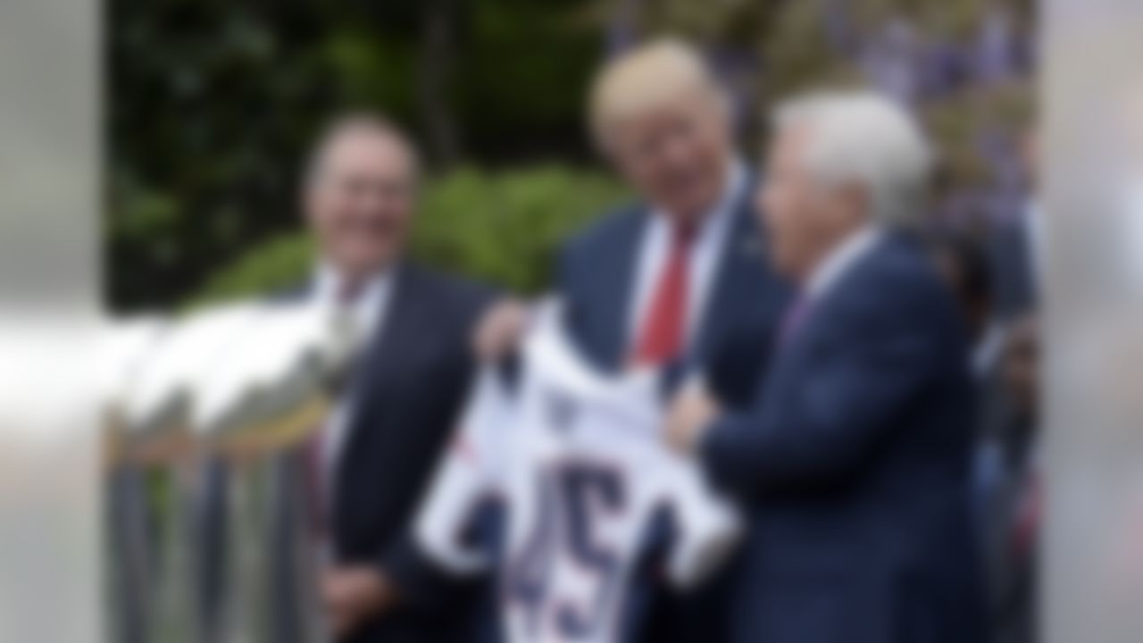 President Donald Trump is presented with a New England Patriots jersey from Patriots owner Robert Kraft, right, and head coach Bill Belichick during a ceremony on the South Lawn of the White House in Washington, Wednesday, April 19, 2017, where the president honored the Super Bowl Champion New England Patriots for their Super Bowl LI victory. (Susan Walsh/Associated Press)