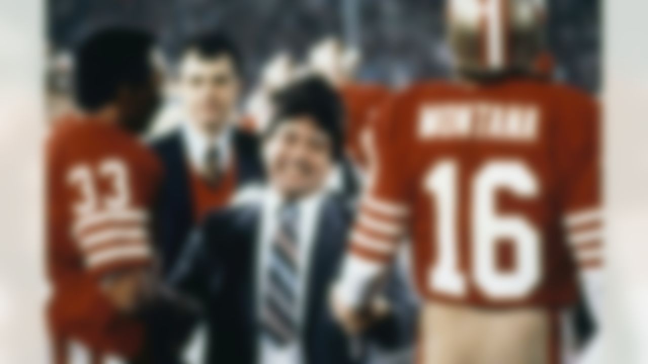 San Francisco 49ers Eddie Debartolo Jr. congratulates quarterback Joe Montana (16) and running back Roger Craig (33) after the 49ers defeated the Miami Dolphins to win Super Bowl XIX at Stanford Stadium in Stanford, CA on January 20, 1985. (Associated Press)