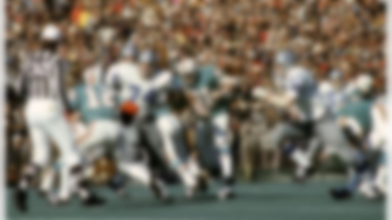 Hall of Fame defensive tackle Bob Lilly (74) of the Dallas Cowboys chases Dolphins Hall of Fame quarterback Bob Griese (12) during the Cowboys 24-3 victory over the Miami Dolphins in Super Bowl VI on January 16, 1972 at Tulane Stadium in New Orleans, Louisiana. (National Football League)