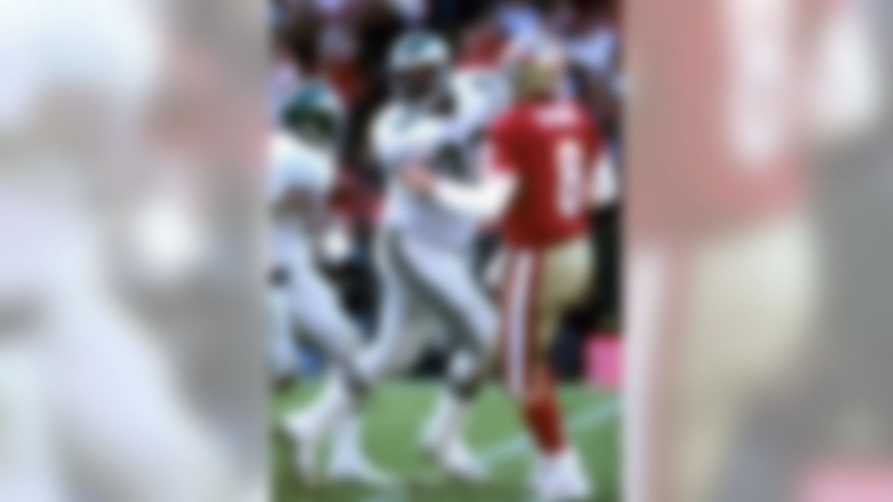 Green Bay Packers defensive end Reggie White with San Francisco 49ers Steve Young in 1992. (Al Messerschmidt/NFL)