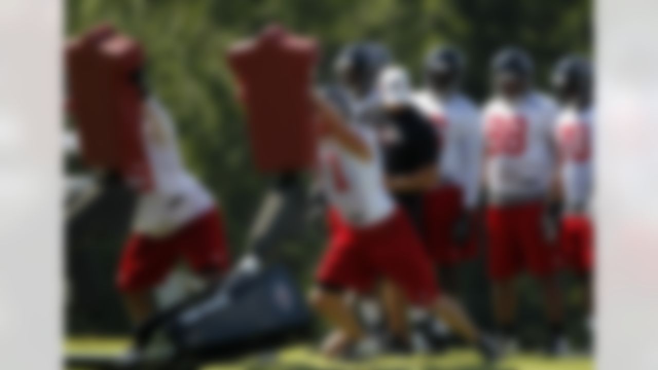 Atlanta Falcons' Kroy Biermann works during a drill during football training camp in Flowery Branch, Ga., Friday, July 27, 2012. (AP Photo/John Bazemore)