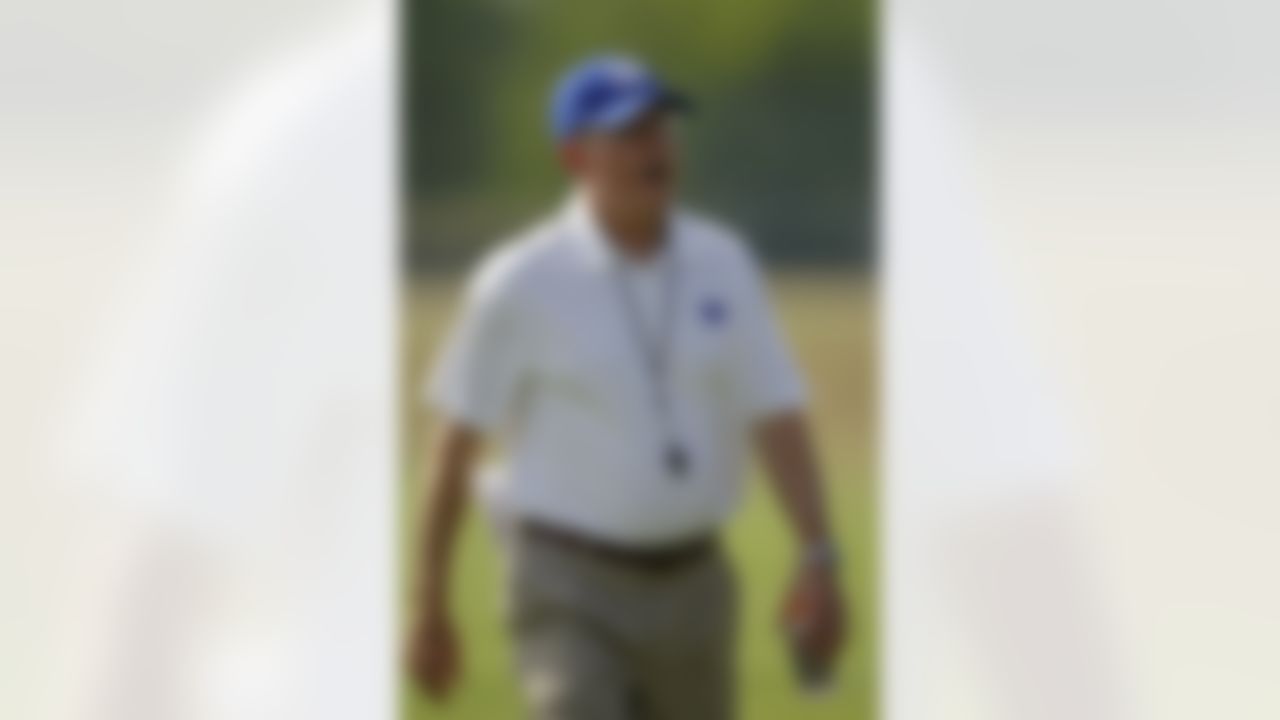 New York Giants head football coach Tom Coughlin yells on the field following a physical evaluation drill on opening day of NFL football training camp in Albany, N.Y., Thursday, July 26, 2012. (AP Photo/Kathy Willens)