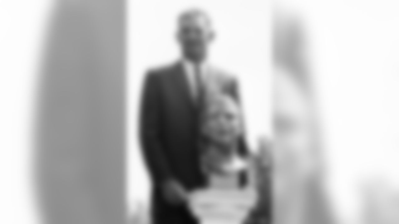 Sammy Baugh poses with bust after he was enshrined in the National Pro Football Hall of Fame, Sept. 7, 1963 in Canton, Ohio, during dedication ceremonies. (Associated Press)
