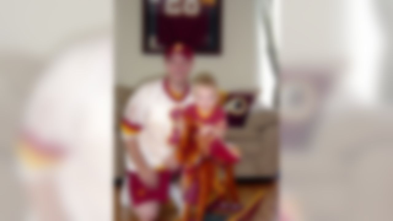 Robbie Shanholtz plays Cowboys and Redskins with his son, Ashton, before laying their heads on a team pillow for a midday nap.