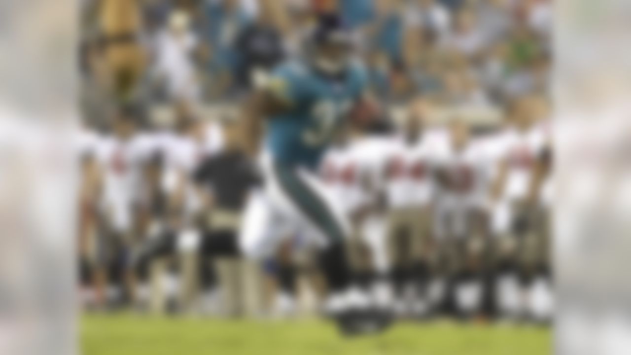 JACKSONVILLE, FL - AUGUST 18: Running back Maurice Jones-Drew #32 of the Jacksonville Jaguars returns a kick against the Tampa Bay Buccaneers at Jacksonville Municipal Stadium on August 18, 2007 in Jacksonville, Florida. (Photo by Al Messerschmidt/Getty Images)