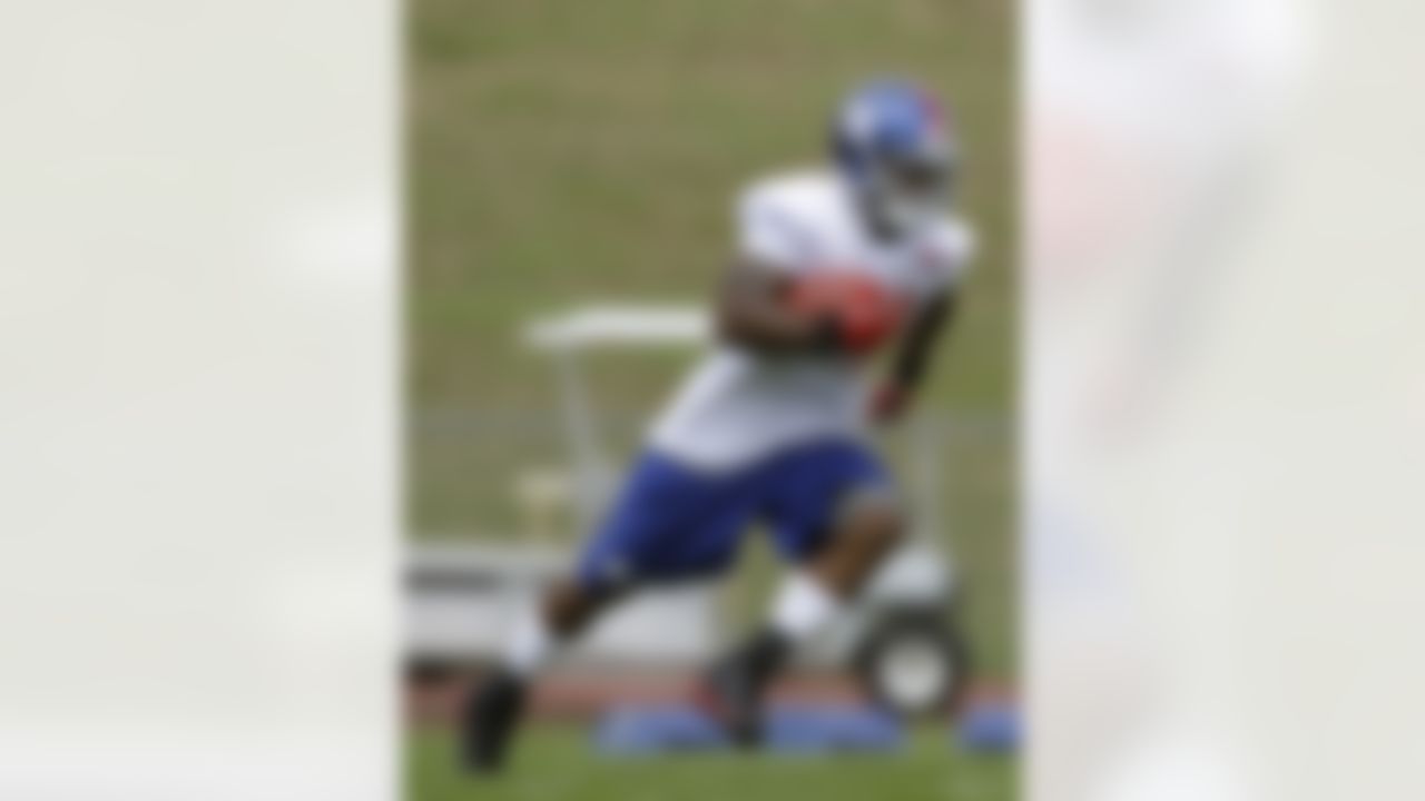 New York Giants running back Ahmad Bradshaw (44) carries the ball during a practice at the New York Giants football training camp in Albany, N.Y., Friday, July 27, 2012. Despite winning the Super Bowl, the Giants were the NFL's worst team rushing. Bradshaw, the team's No. 1 running back, said, "That's devastating for us." (AP Photo/Kathy Willens)
