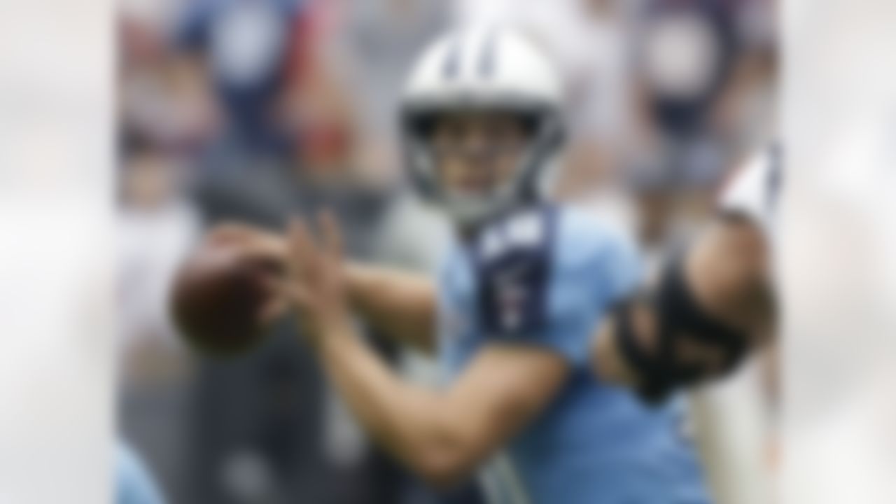 Tennessee Titans' Jake Locker (10) looks to throw against the Houston Texans during the first quarter of an NFL football game on Sunday, Sept. 15, 2013, in Houston. (AP Photo/Patric Schneider)