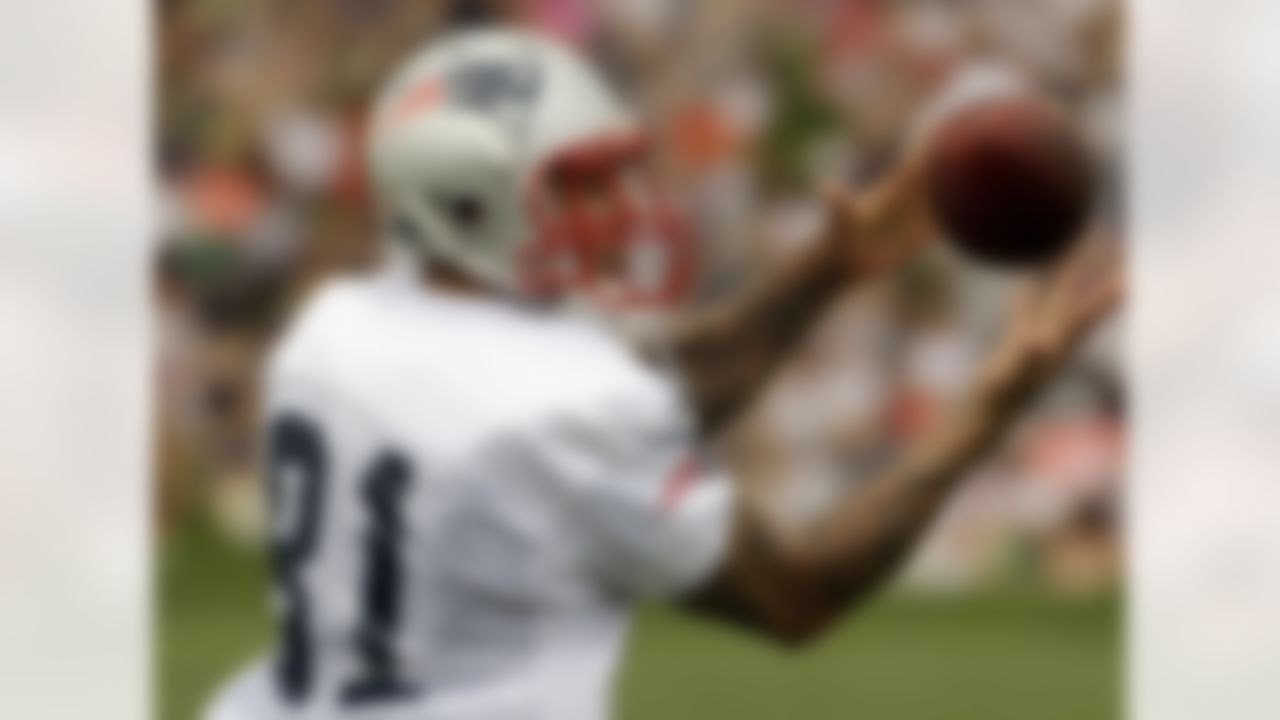 New England Patriots tight end Aaron Hernandez pulls in a pass during practice on the second day of NFL football training camp in Foxborough, Mass., Friday, July 27, 2012. (AP Photo/Stephan Savoia)
