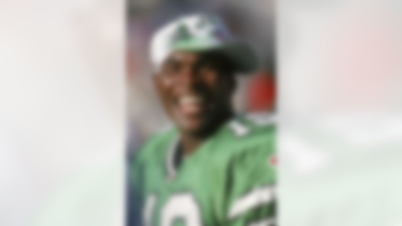 New York Jets wide receiver Keyshawn Johnson (19) smiles on the sideline during an NFL game the Arizona Cardinals on October 27, 1996, at Sun Devil Stadium in Tempe, Arizona. The Jets defeated the Cardinals 31-21 in overtime.