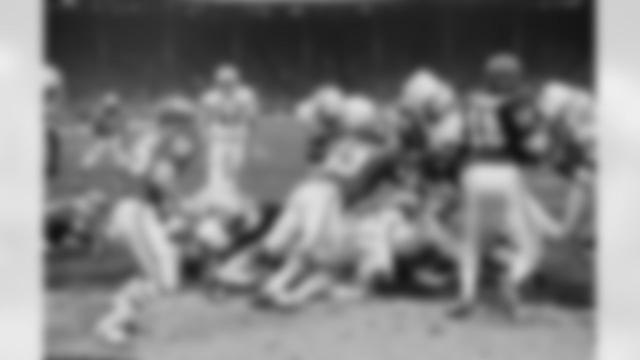 Miami's Jim Kiick (21) gets to the less-then-a-foot line before being stopped by Kansas City's Willie Lanier (63) in the playoff game with the Chiefs. On the next play, Kiick scored for the Dolphins. Miami beat Kansas City 27-24 in an overtime period on Dec. 25, 1971 in Kansas City. (Associated Press)