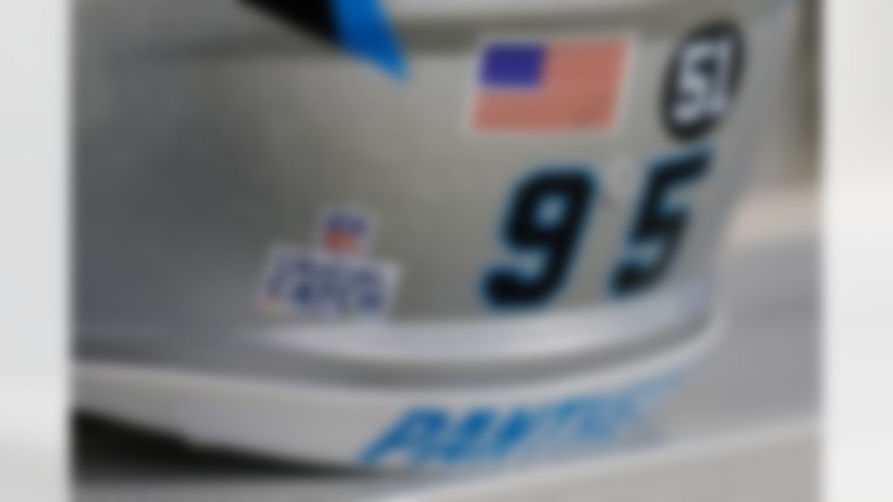 The number 51 and the Crucial Catch logo was on the back of all Carolina Panthers' helmets in honor of deceased linebacker and coach, Sam Mills before an NFL football game against the Philadelphia Eagles in Charlotte, N.C., Thursday, Oct. 12, 2017. The Eagles won 28-23.