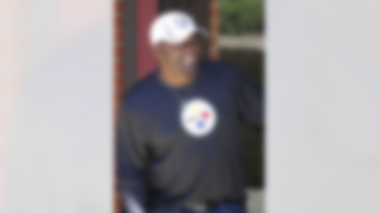 Pittsburgh Steelers head coach Mike Tomlin smiles as he looks from the players dormitory as the players arrive for NFL football training camp at the team's training facility in Latrobe, Pa., on Wednesday, July 25, 2012 . (AP Photo/Keith Srakocic)