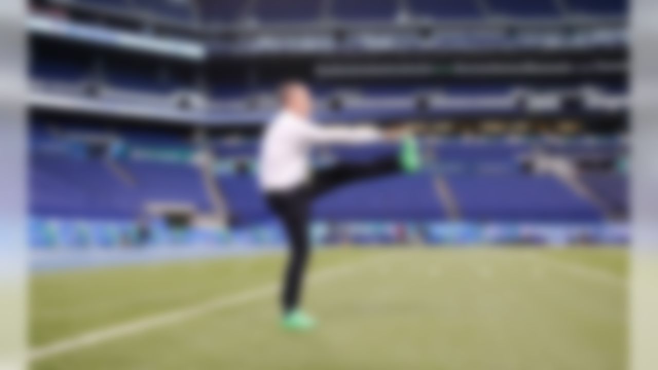 Rich Eisen stretches before running his annual 40-yard dash benefiting St. Jude Children's Research Hospital during the 2016 NFL Scouting Combine on Sunday, Feb. 28, 2016 in Indianapolis. (Ben Liebenberg/NFL)