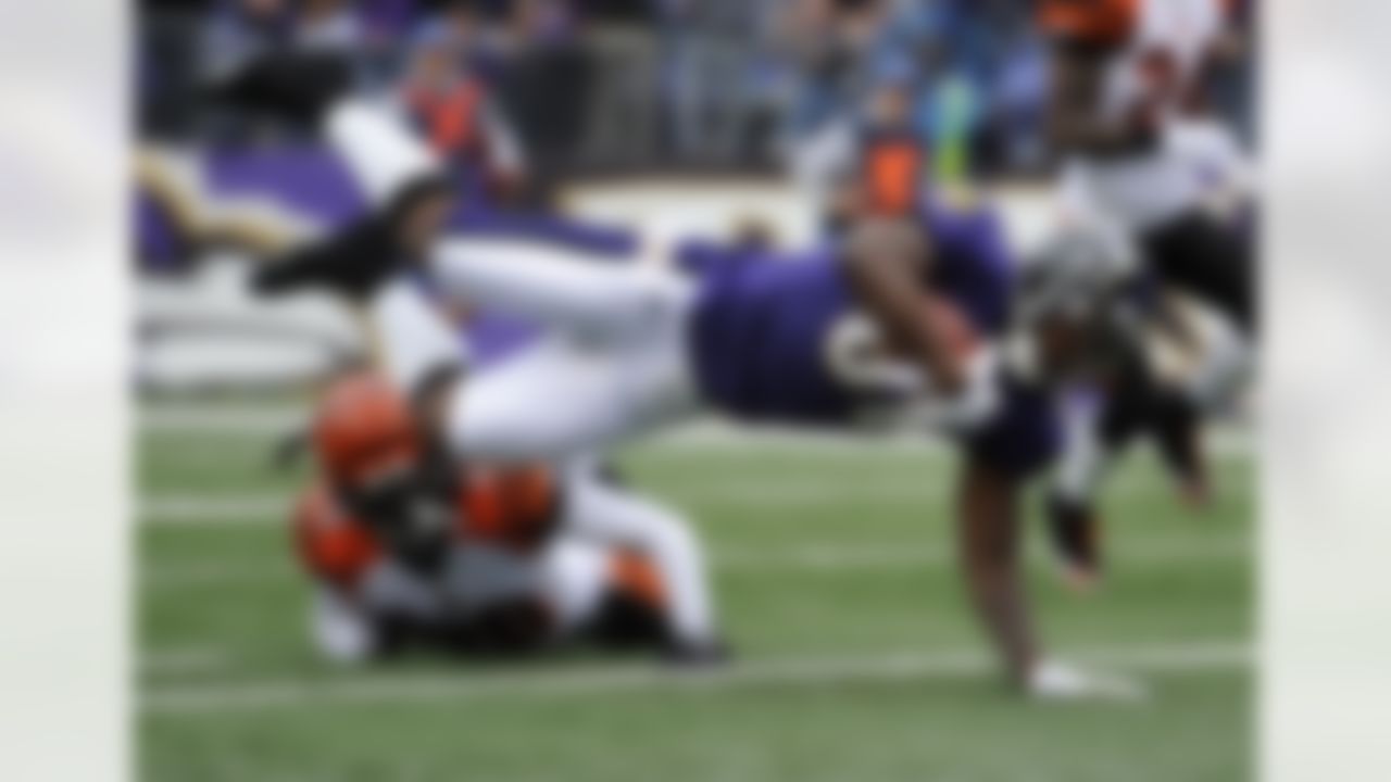 Baltimore Ravens wide receiver Anquan Boldin (81) dives into the end zone for a touchdown over Cincinnati Bengals free safety Reggie Nelson in the first half of an NFL football game in Baltimore, Sunday, Nov. 20, 2011. (AP Photo/Nick Wass)
