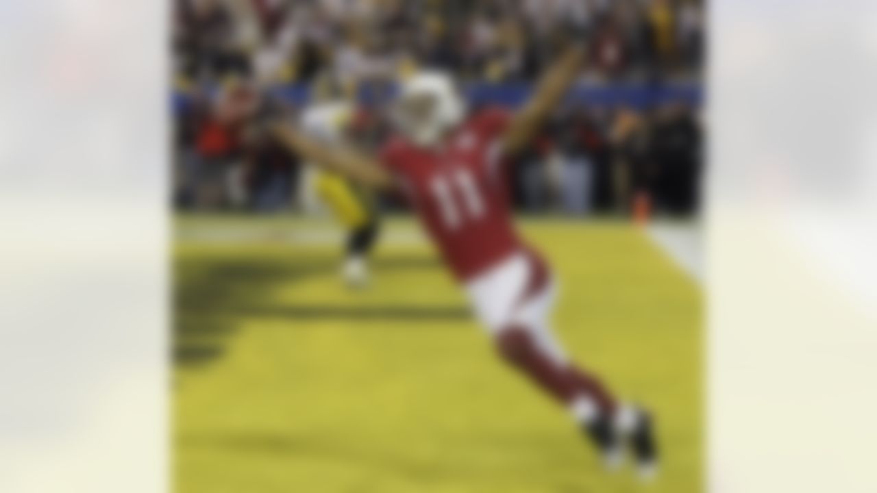 Arizona Cardinals wide receiver Larry Fitzgerald celebrates his 64-yard touchdown reception against the Pittsburgh Steelers in the fourth quarter of Super Bowl XLIII football game, Sunday, Feb. 1, 2009, in Tampa, Fla. (AP Photo/Ross D. Franklin)