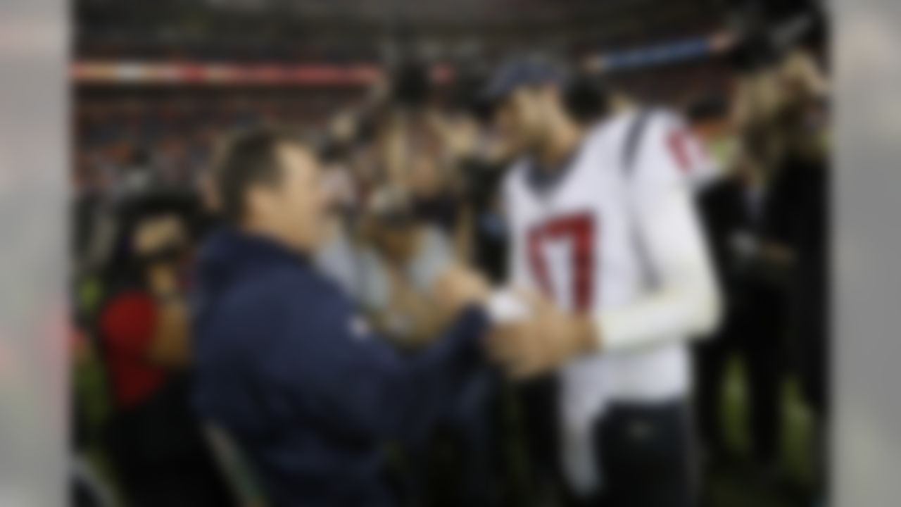 Houston Texans quarterback Brock Osweiler (17) and Denver Broncos head coach Gary Kubiak meet after an NFL football game, Monday, Oct. 24, 2016, in Denver. The Broncos defeated the Texans, 27-9. (Ryan Kang/NFL)