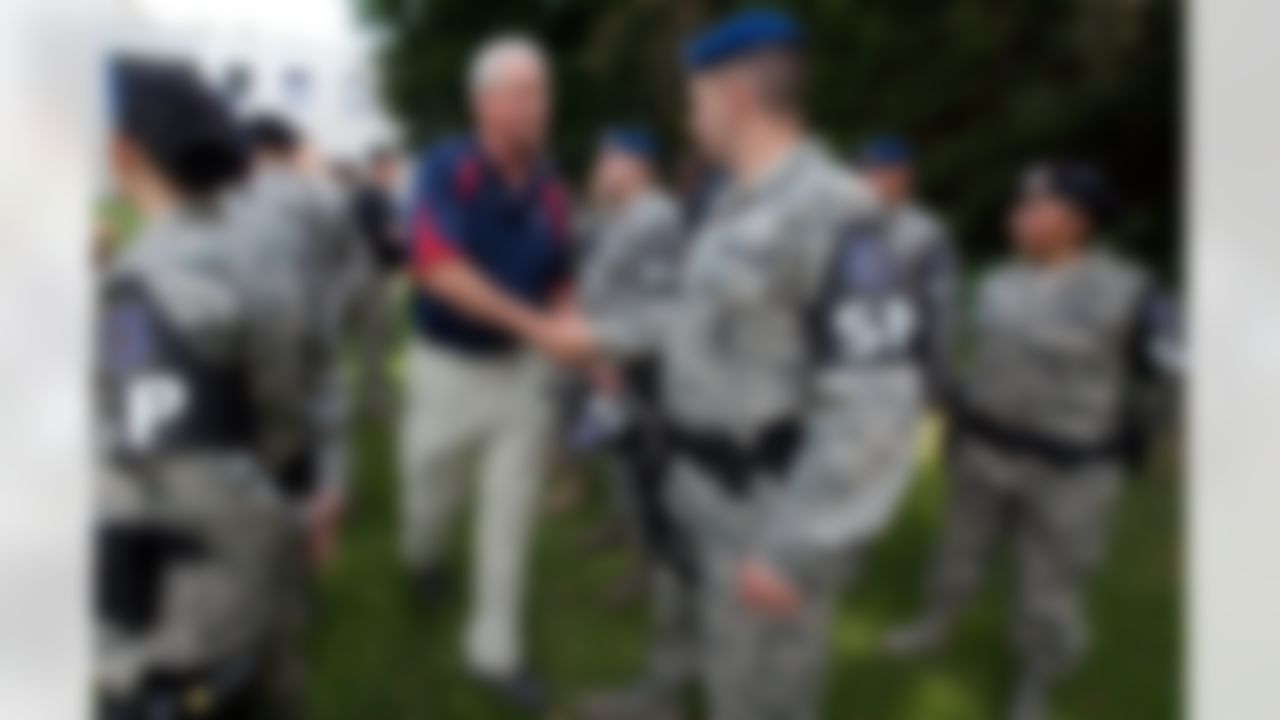Carolina Panthers head coach John Fox visits with MP's at Kaiserslautern Air Base in Germany during a USO/Armed Forces Entertainment tour stop on June 30, 2010. This is the first overseas USO tour for Fox who is joined by three other top NFL coaches touring bases in Germany and the Persian Gulf region. (Fred Greaves/USO)