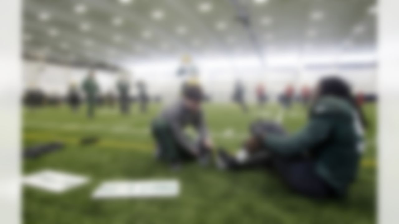 Green Bay Packers' Erik Walden, right, is helped by a trainer during practice, Wednesday, Feb. 2, 2011 in Dallas. Green Bay will face the Pittsburgh Steelers in the NFL football Super Bowl XLV Sunday. (AP Photo/Eric Gay)