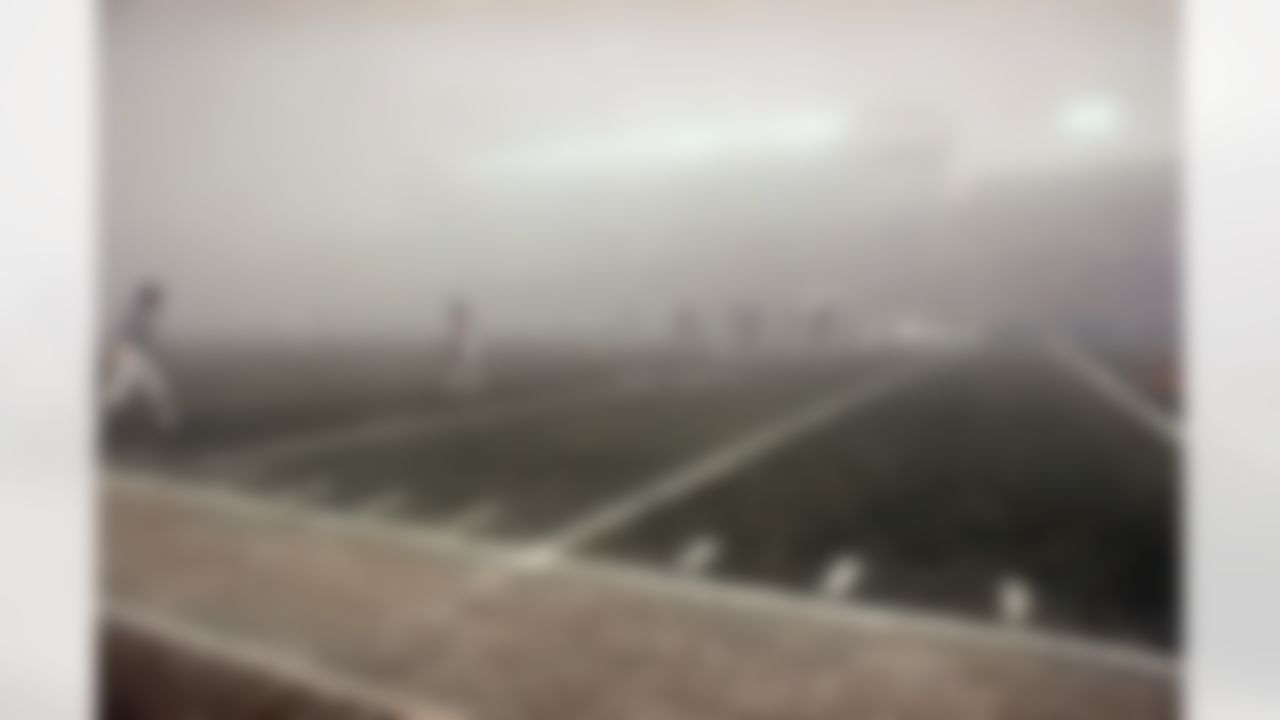 Lights shine through the fog during play between the Chicago Bears and the Philadelphia Eagles at their semi final NFC playoff game in Chicago, Saturday, Dec. 31, 1988. A heavy fog enveloped Soldiers Field creating decreased visibility. (Associated Press)