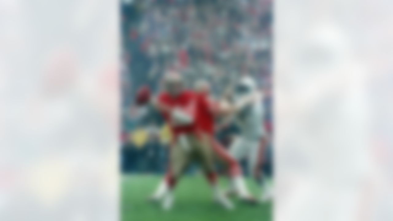San Francisco 49ers quarterback Joe Montana (16) looks for a receiver behind protective blocking of left guard John Ayers (68), during the first half of the Super Bowl XIX at Stanford Stadium in Stanford, CA on January 20, 1985. (Associated Press)