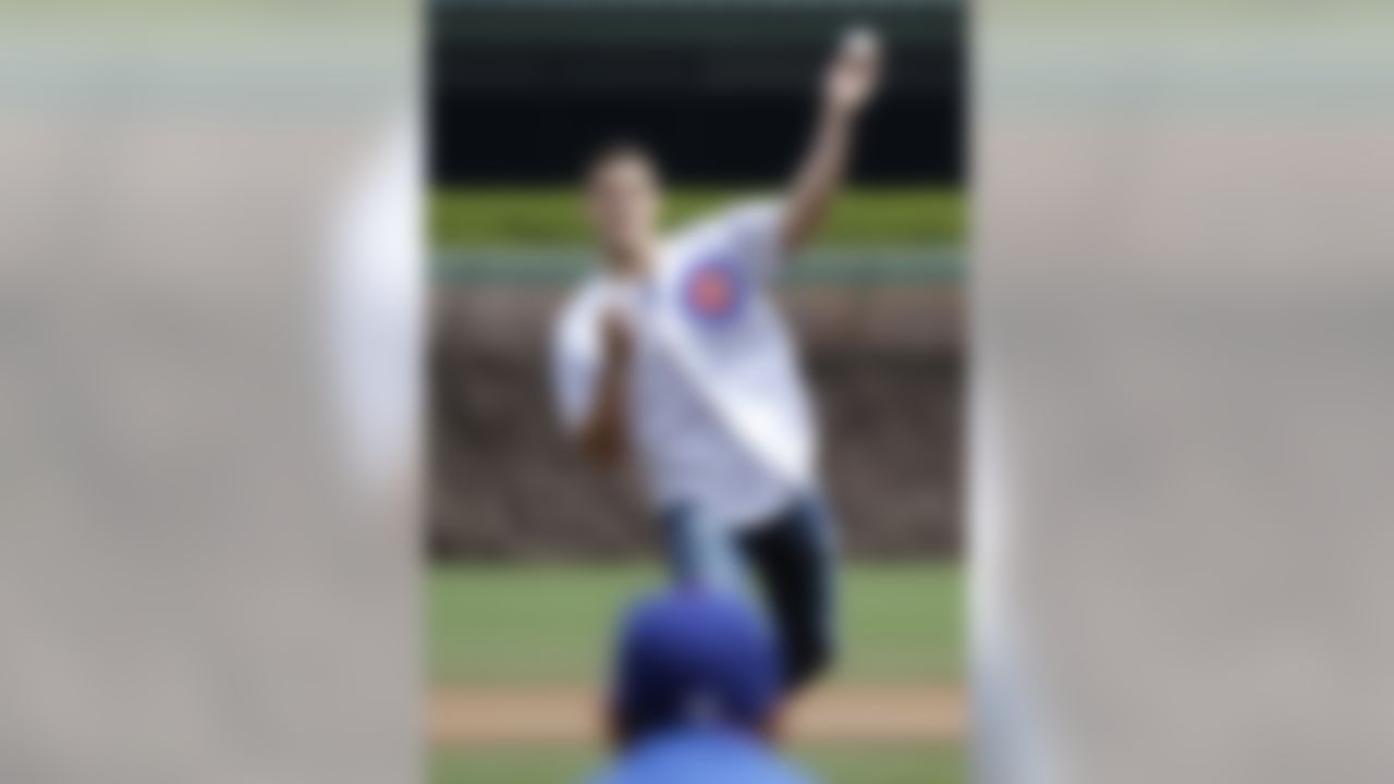 Chicago Bears tight end Steve Maneri throws out the ceremonial first pitch before a baseball between the Cincinnati Reds and the Chicago Cubs in Chicago, Saturday, May 4, 2013. (AP Photo/Nam Y. Huh)