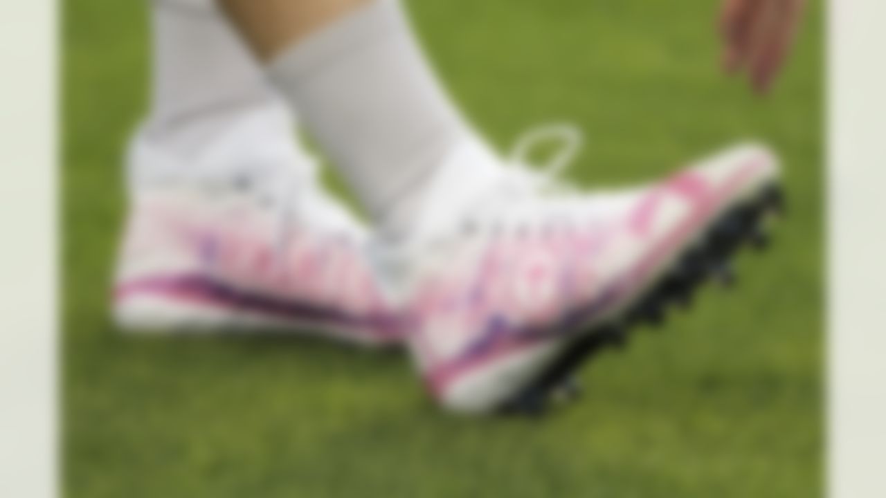 Philadelphia Eagles quarterback Carson Wentz' cleats are shown as he warms up before an NFL football game against the Carolina Panthers in Charlotte, N.C., Thursday, Oct. 12, 2017.
