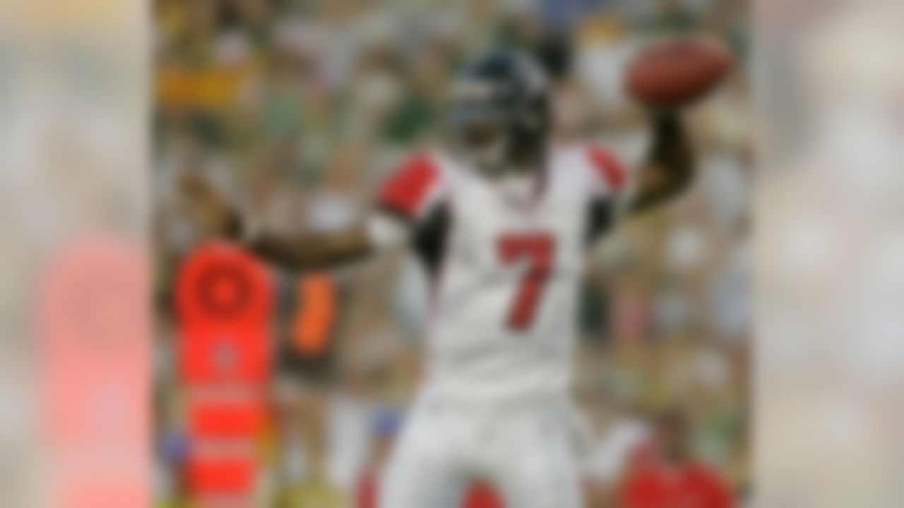 Atlanta Falcons quarterback Michael Vick goes back to pass during the first quarter against the Green Bay Packers during an NFL preseason football game Saturday, Aug. 19, 2006, in Green Bay, Wis. (AP Photo/Morry Gash)