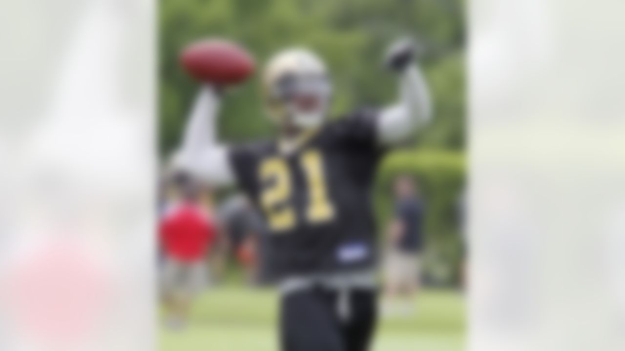 New Orleans Saints safety Chip Vaughn (21) tosses a ball during practice at the club's NFL football training facility in Metairie, Friday, June 4, 2010. (AP Photo/Bill Haber)