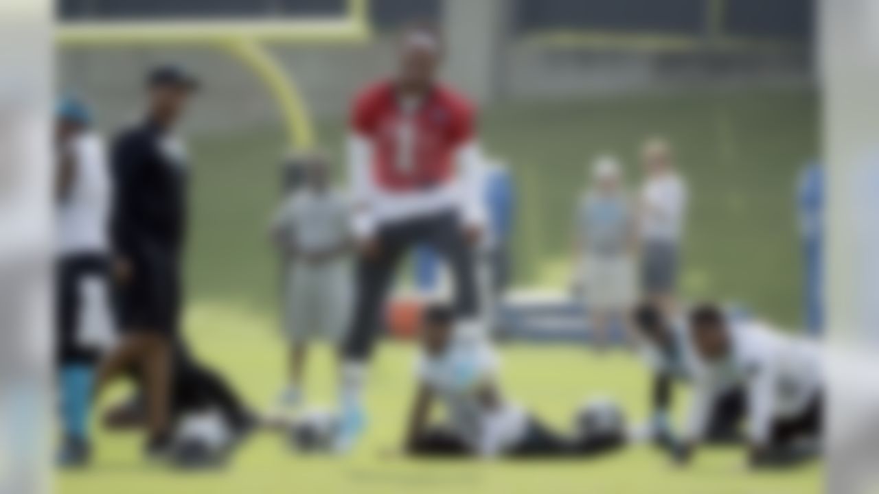 Carolina Panthers' Cam Newton (1) reacts as he jokes with players and coaches during the NFL football team's practice in Charlotte, N.C., Thursday, June 14, 2018.