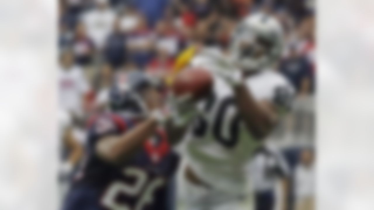The Houston Texans' Brandon Harris is called for pass interference as the Oakland Raiders' Rod Streater attempts to catch a pass. (AP Photo/Tony Gutierrez)
