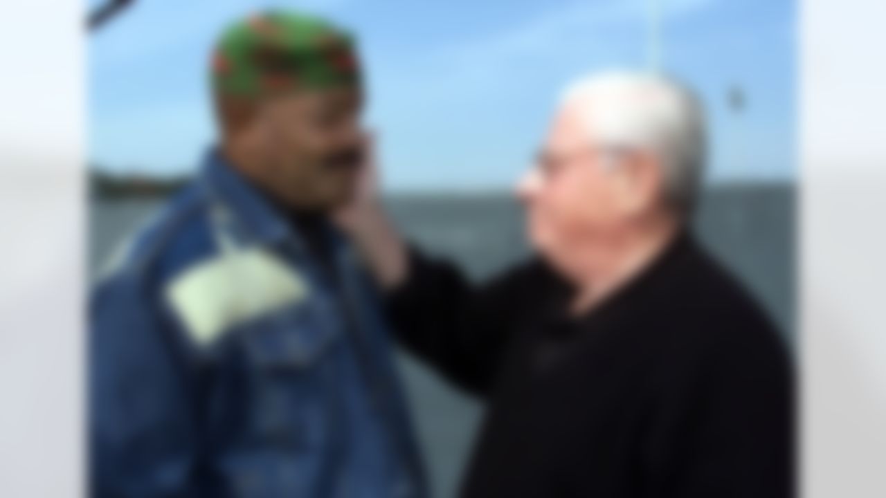 Baltimore Ravens owner Art Modell, right, greets NFL Hall of Famer Jim Brown during team practice in Tampa, Fla., Friday Jan. 26, 2001. The Ravens will face the New York Giants in Super Bowl XXXV Sunday Jan. 28. (AP Photo/Roberto Borea)