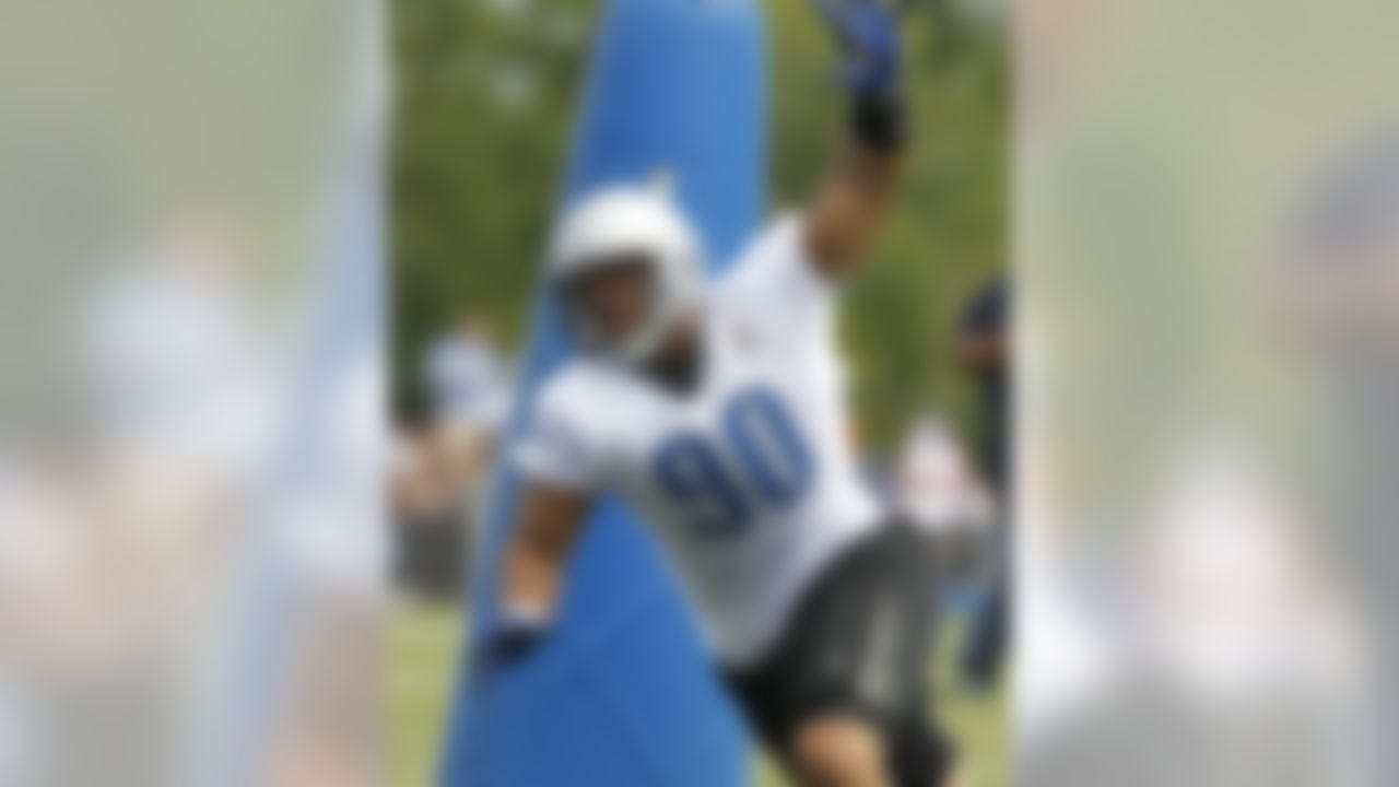 Detroit Lions defensive tackle Ndamukong Suh (90) works out during NFL football training  camp in Allen Park, Mich., Wednesday, Aug. 4, 2010. (AP Photo/Carlos Osorio)