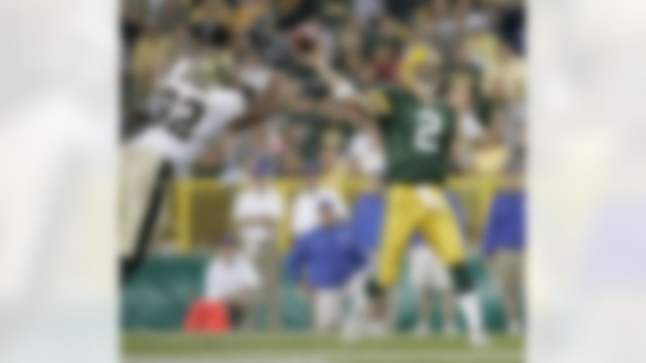 New Orleans Saints' Tony Bryant pressures Green Bay Packers' quarterback Tim Couch Saturday night Aug. 21, 2004, at Lambeau Field in Green Bay, Wis. during the fourth quarter of their preseason game. The Packers won 19-14. (Mike Roemer/AP Photo)