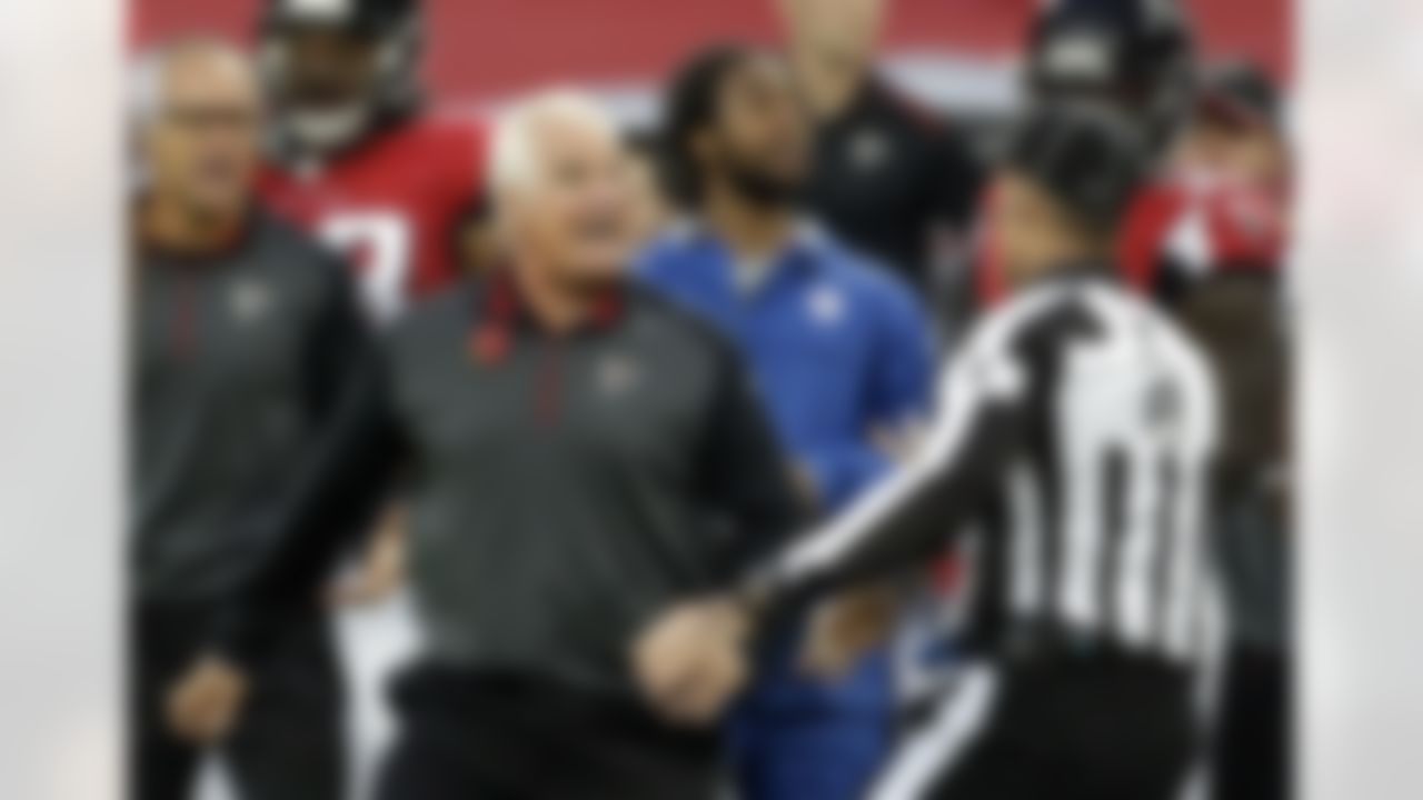 Atlanta Falcons head coach Mike Smith argues with an official in the second half of the NFL football game against the Detroit Lions at Wembley Stadium, London, Sunday, Oct. 26, 2014. The Lions won 22-21. (AP Photo/Matt Dunham)