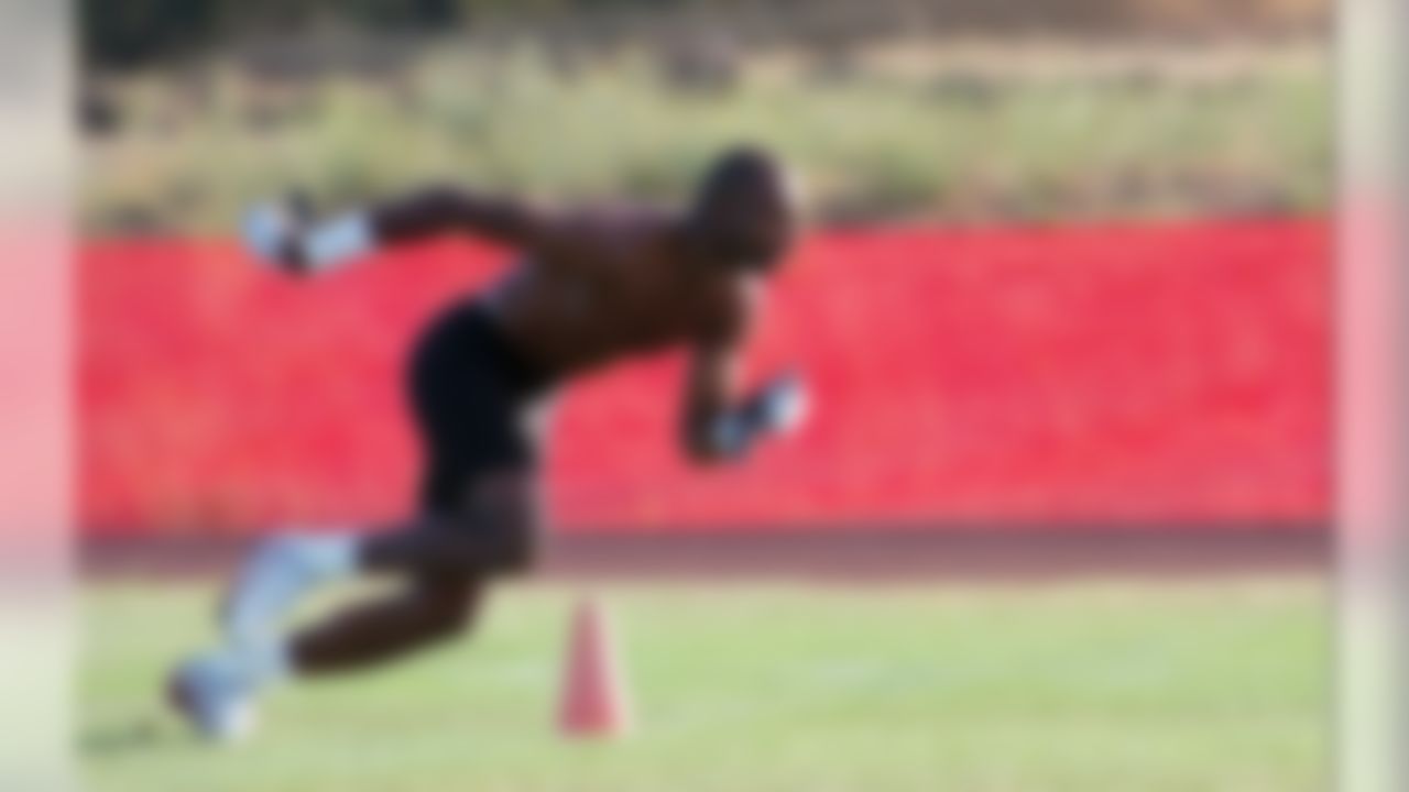 San Francisco 49ers wide receiver Jerry Rice runs wind sprints alone on the practice field before the first practice at the 49ers training camp at Sierra College in Rocklin, Calif., Thursday, July 17, 1997. While most of the veterans do not have to report for practice until Saturday, some, like Rice and quarterback Steve Young reported in early. (AP Photo/Steve Yeater)