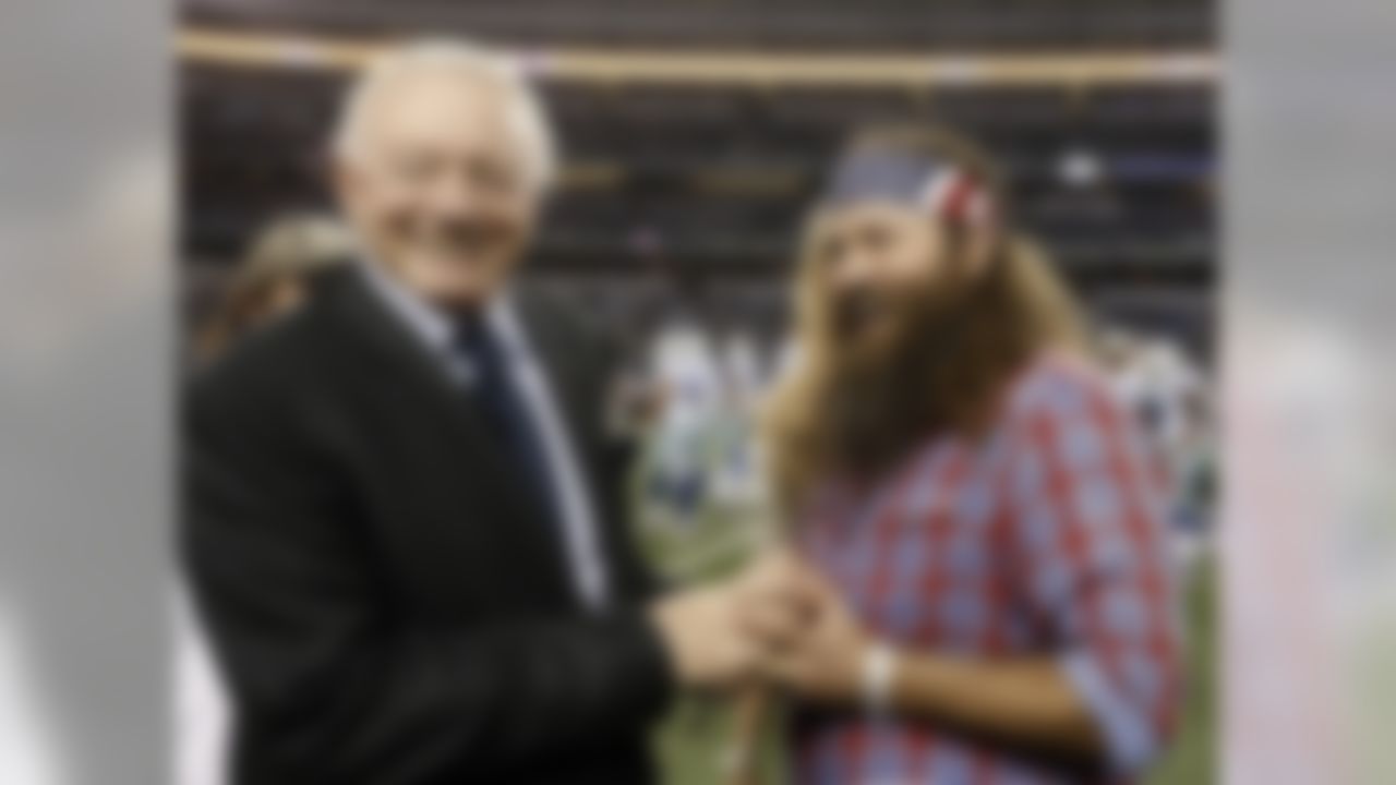 Dallas Cowboys team owner Jerry Jones speaks with Willie Robertson of Duck Dynasty fame during team warm ups before an NFL football game against the Indianapolis Colts, Sunday, Dec. 21, 2014, in Arlington, Texas. (AP Photo/Brandon Wade)