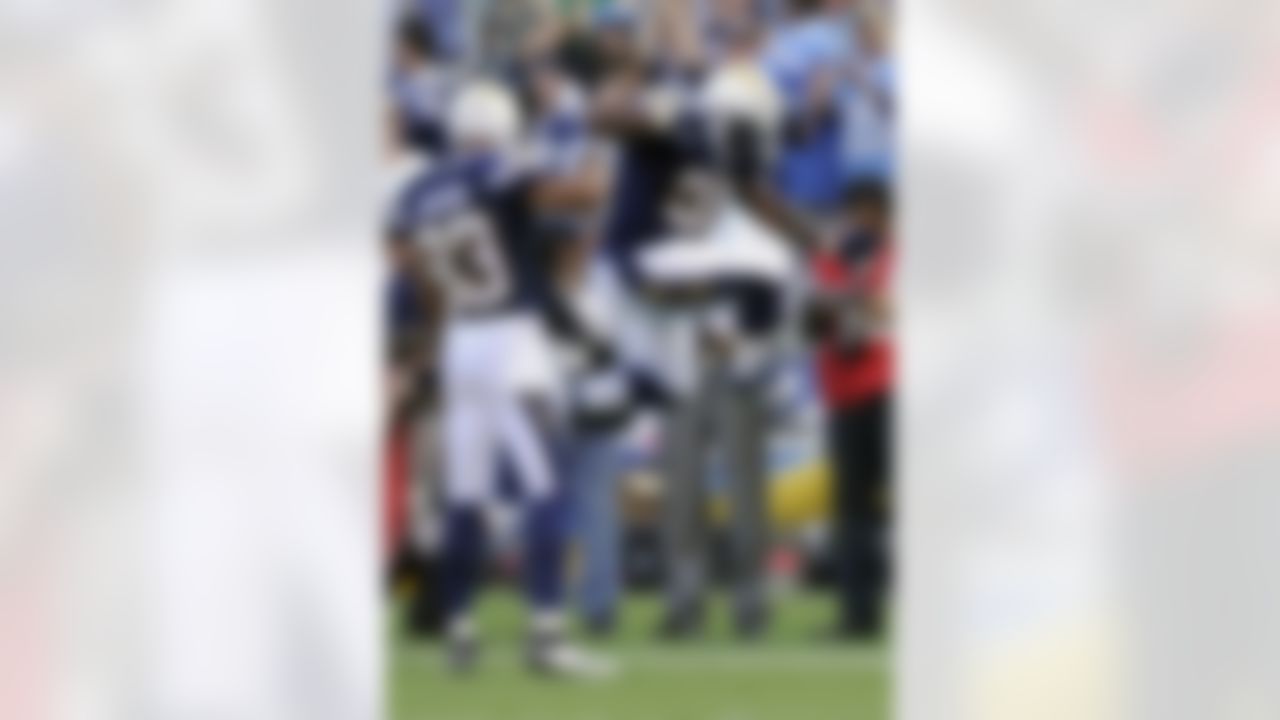 San Diego Chargers fullback Mike Tolbert, right, reacts after scoring a touchdown as teammate wide receiver Vincent Jackson looks on while playing the Seattle Seahawks during the first half of their preseason NFL football game at Qualcomm Stadium, Thursday, Aug. 11, 2011, in San Diego. (AP Photo/Mark J. Terrill)