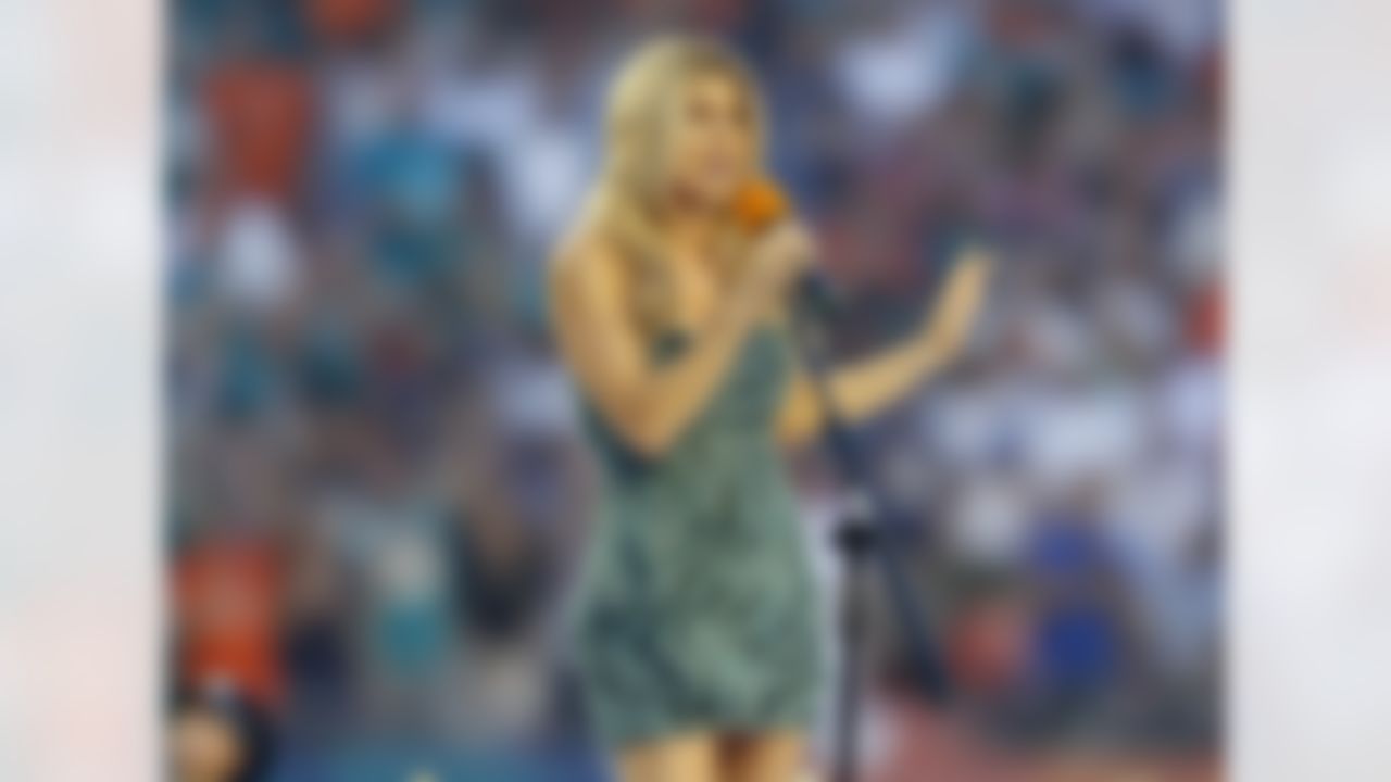 Part owner of the Miami Dolphins Stacy Ann Ferguson, also known as Fergie, sings the National Anthem before the NFL week 1 football game against the New England Patriots on Monday, September 12, 2011 in Miami Gardens, Florida. The Patriots won the game 38-24. (AP Photo/Paul Spinelli)