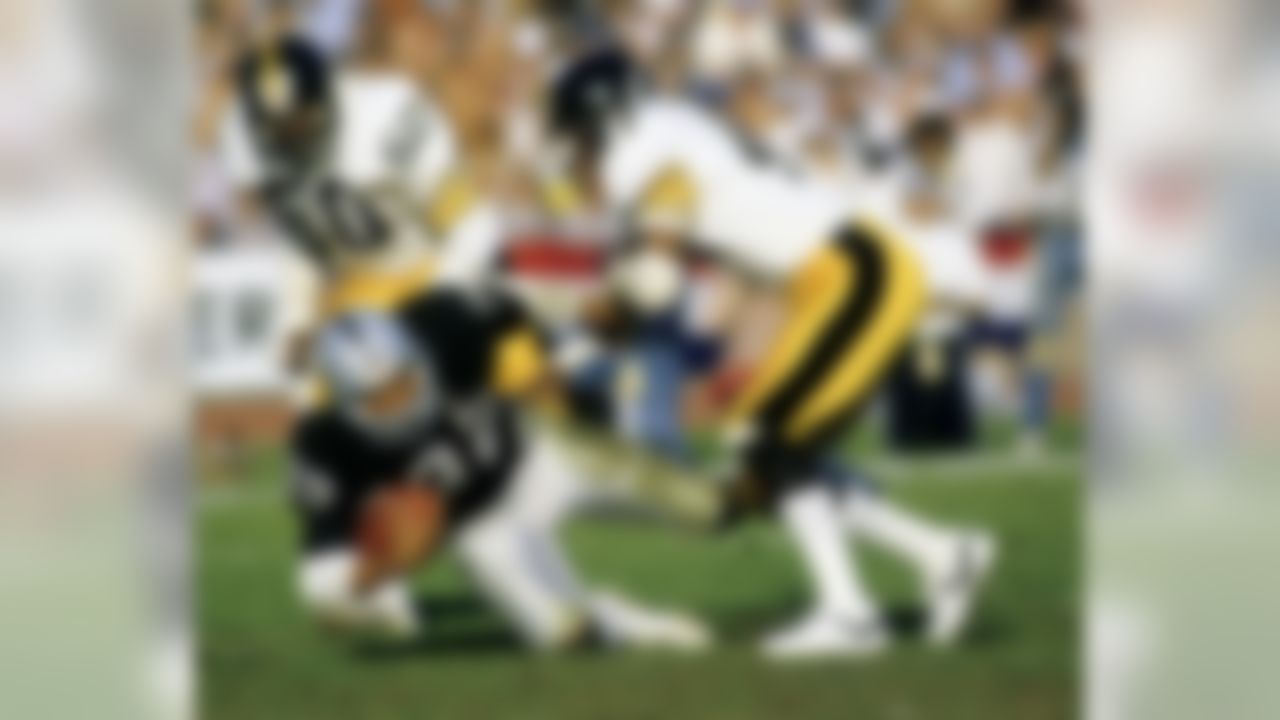 Hall of Fame running back Marcus Allen of the Los Angeles Raiders carries the football before being tackled by Steelers Hall of Fame cornerback Mel Blount during the Raiders 38-10 victory over the Pittsburgh Steelers in the 1983 AFC Divisional Playoff Game on January 1, 1984 at the Los Angeles Memorial Coliseum in Los Angeles, California. (National Football League)