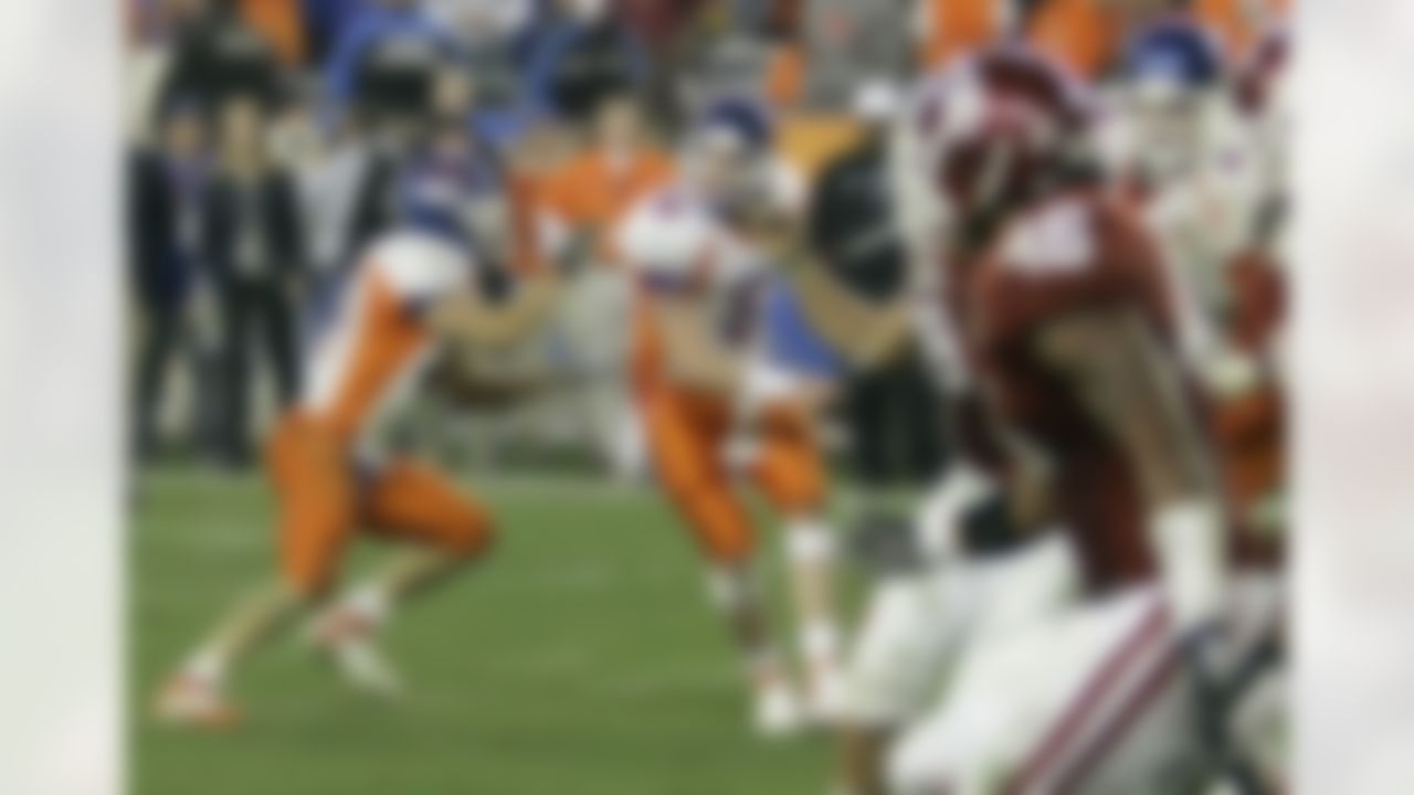 Boise State quarterback Jared Zabransky (5) hands the ball off behind his back to Boise State tailback Ian Johnson, left, who ran in a two-point conversion to win the Fiesta Bowl college football game 43-42 in overtime against Oklahoma Monday, Jan. 1, 2007 in Glendale, Ariz. (AP Photo/Ted S. Warren)