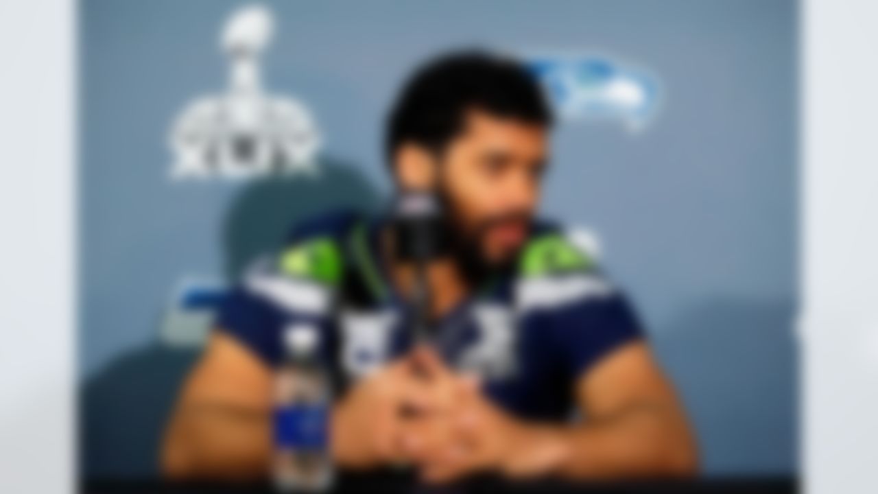 Seattle Seahawks' Russell Wilson answers a question during an interview for NFL Super Bowl XLIX football game, Thursday, Jan. 29, 2015, in Phoenix. The Seahawks play the New England Patriots in Super Bowl XLIX on Sunday, Feb. 1, 2015. (AP Photo/Matt York)